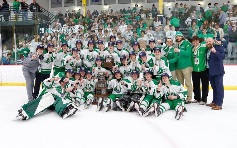 South Fayette Lions celebrating on the ice with the state championship trophy